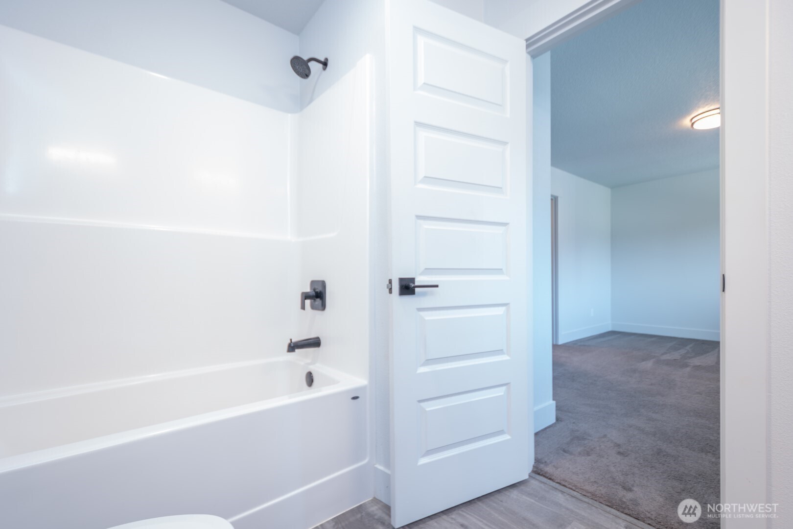 206 Oak Street Winlock, WA 98596 - Photo 8 of 21 a bathroom with a bathtub and shower
