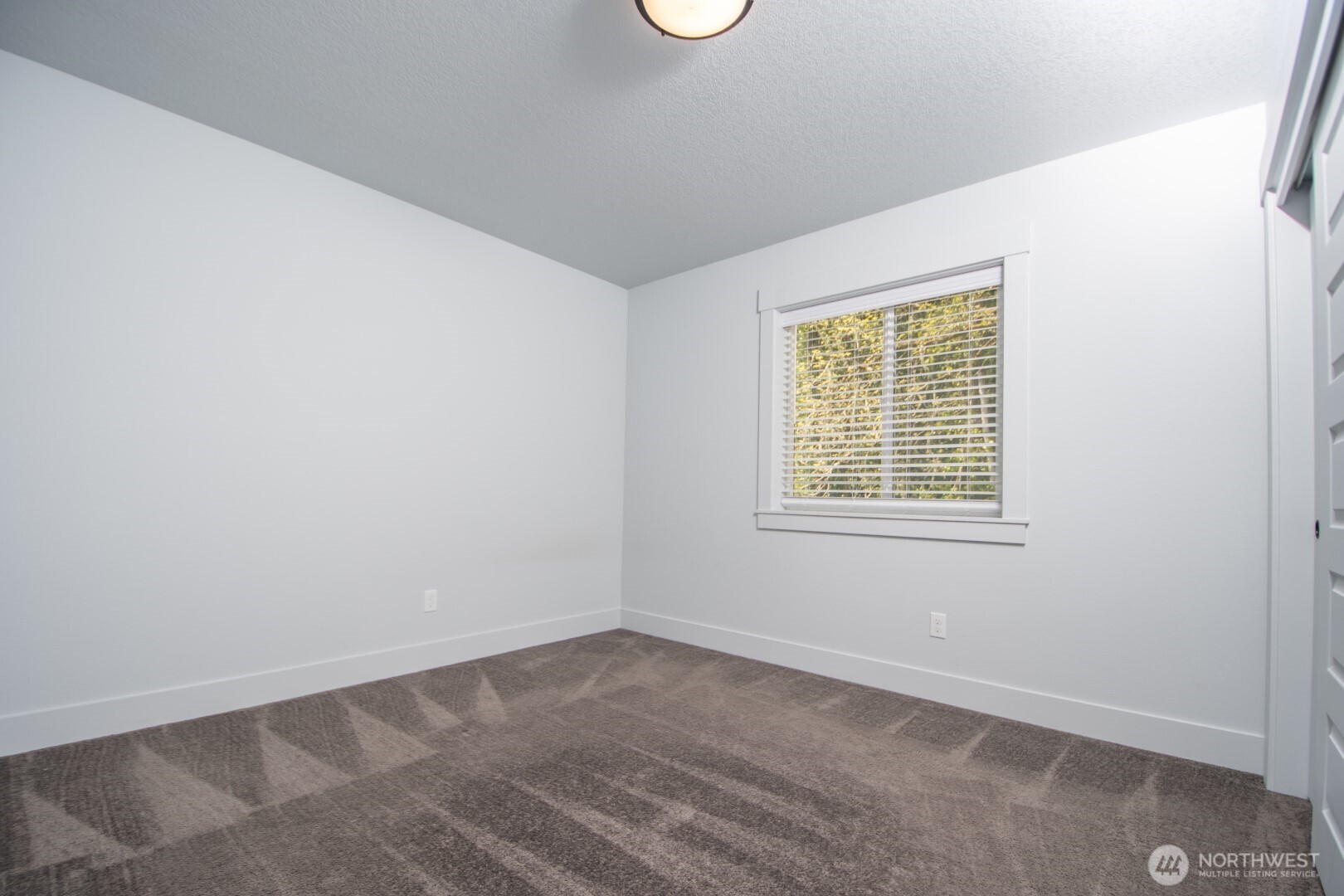 206 Oak Street Winlock, WA 98596 - Photo 10 of 21 an empty room with a window