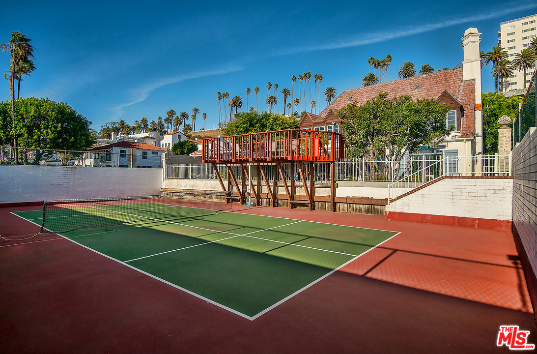 1038 Palisades Beach Road Santa Monica, CA 90403 - Photo 14 of 18 a view of a tennis ground with large trees