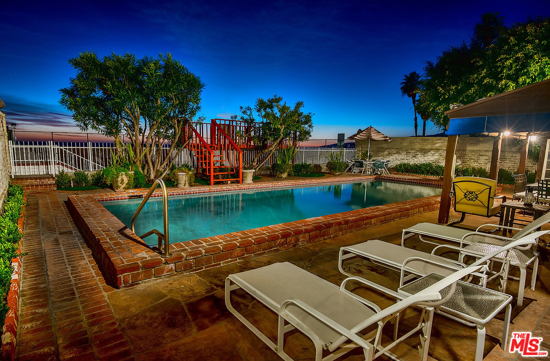 1038 Palisades Beach Road Santa Monica, CA 90403 - Photo 17 of 18 a view of a swimming pool with a patio