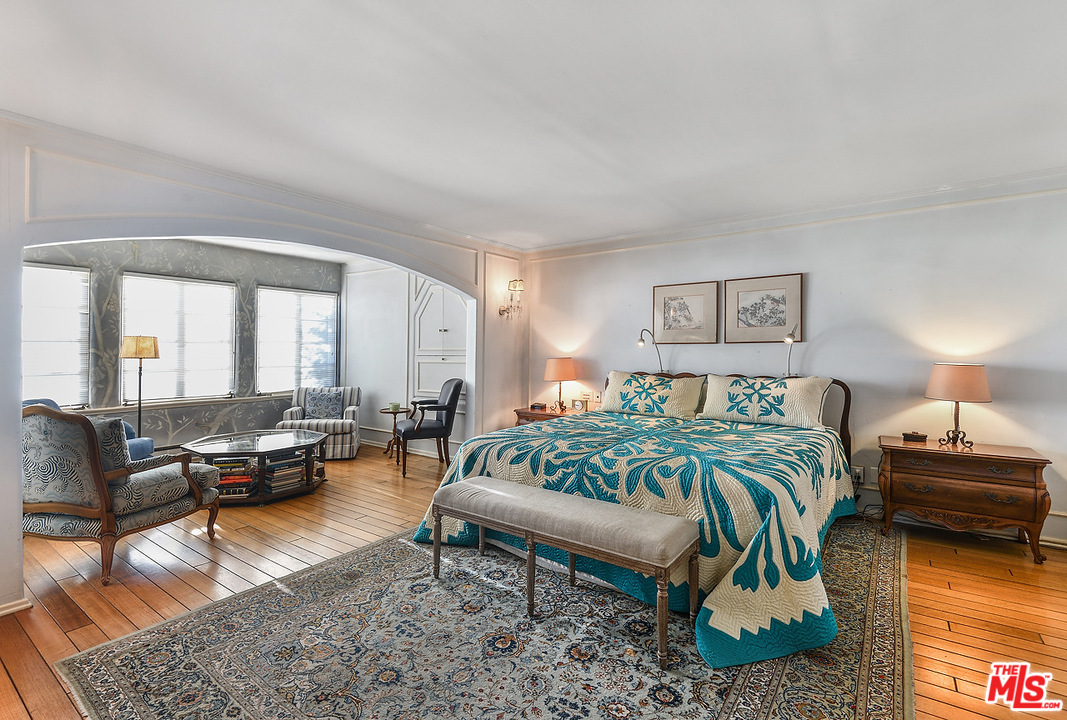 1038 Palisades Beach Road Santa Monica, CA 90403 - Photo 9 of 18 a bedroom with furniture and wooden floor