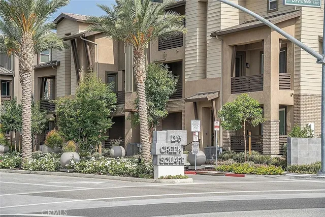 front view of a house with a fountain
