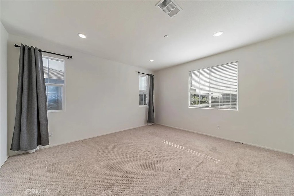 7364 Solstice Place Rancho Cucamonga, CA 91739 - Photo 16 of 19 an empty room with windows