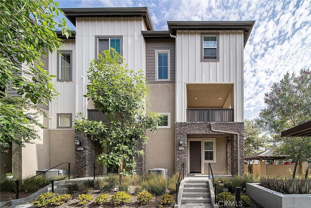 7364 Solstice Place Rancho Cucamonga, CA 91739 - Photo 18 of 19 a front view of a house with garden