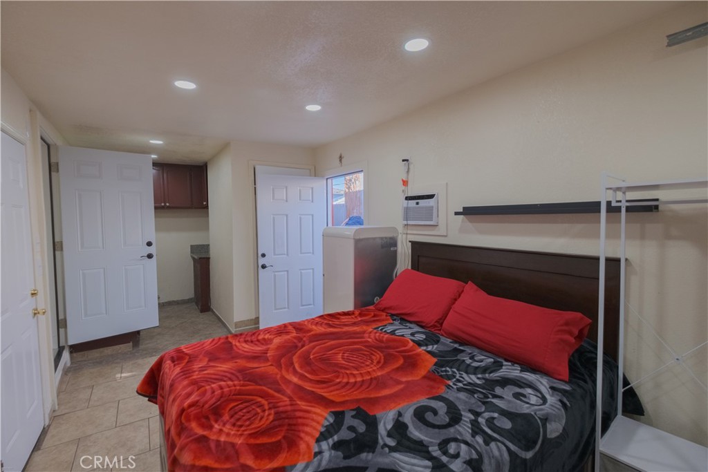 2534 East 127th Street Compton, CA 90222 - Photo 15 of 22 a bedroom with a bed and a closet
