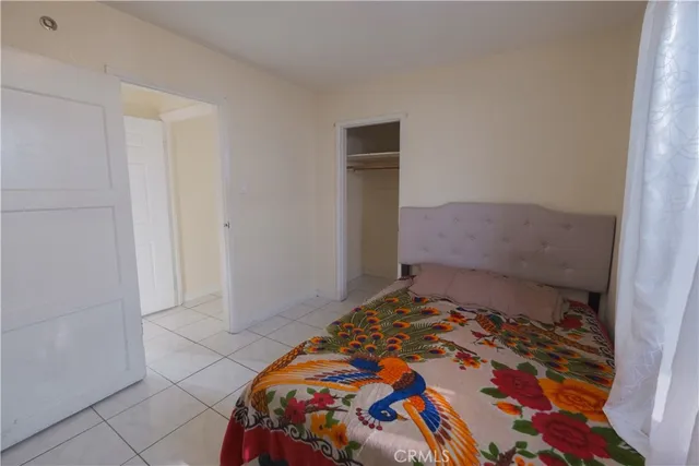 a bedroom with a bed and pillows