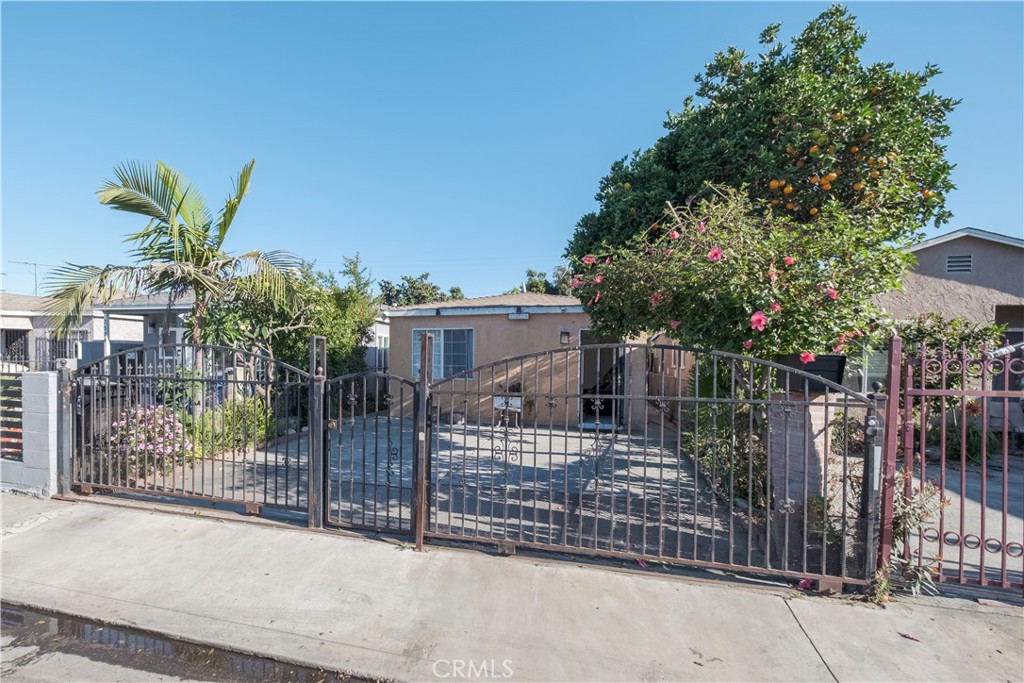 2534 East 127th Street Compton, CA 90222 - Photo 2 of 22 a view of a house with a tree and front door
