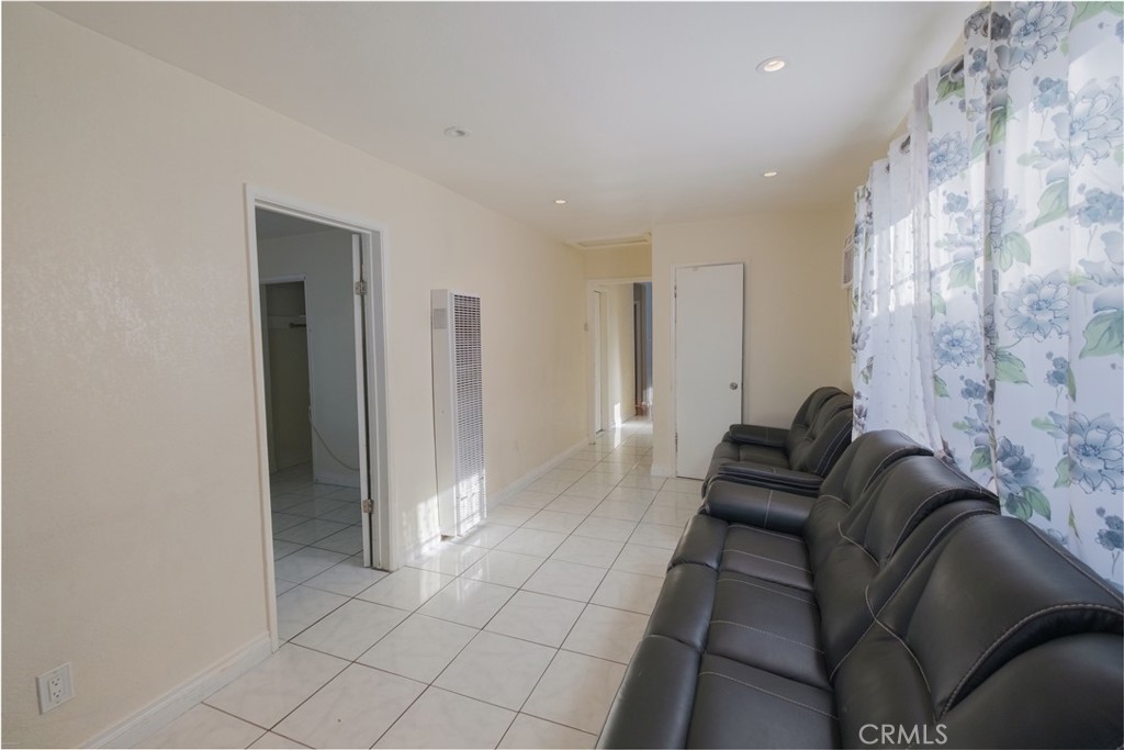 2534 East 127th Street Compton, CA 90222 - Photo 7 of 22 a living room with furniture and a fireplace