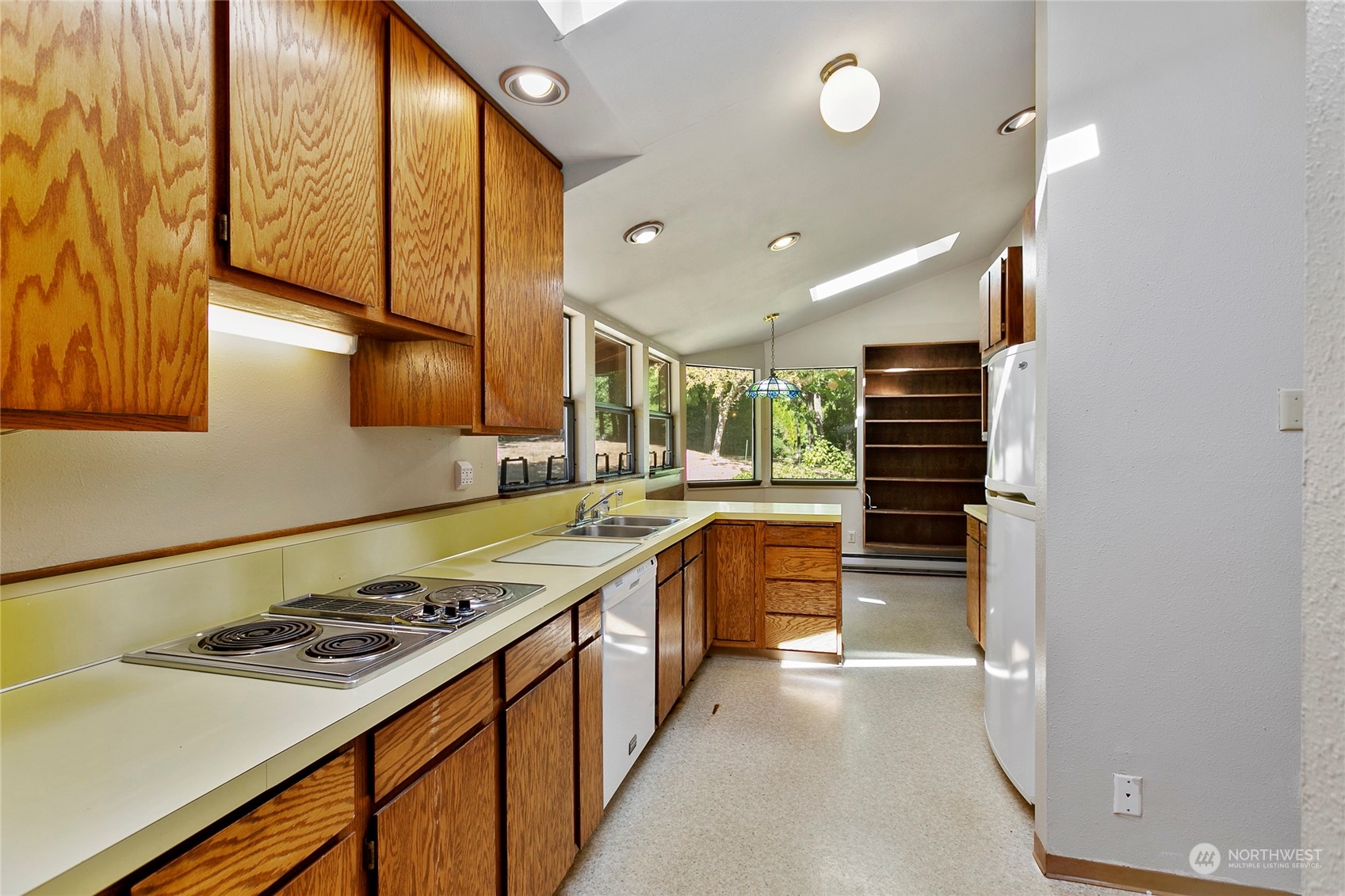 1024 Shaw Road Ferndale, WA 98248 - Photo 17 of 40 a kitchen with a stove and a refrigerator