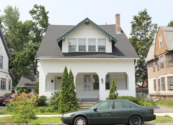 38 Lyndale Street Springfield, MA 01108 - Photo 1 of 25 a front view of a house with a yard