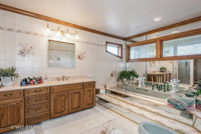 a living room with stainless steel appliances kitchen island granite countertop a sink and cabinets