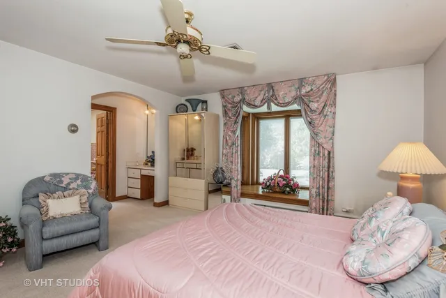 a bedroom with a bed and a couch