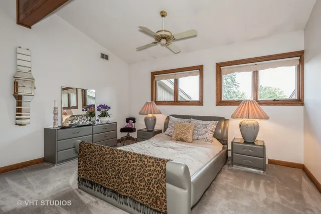 a bedroom with a bed and a couch