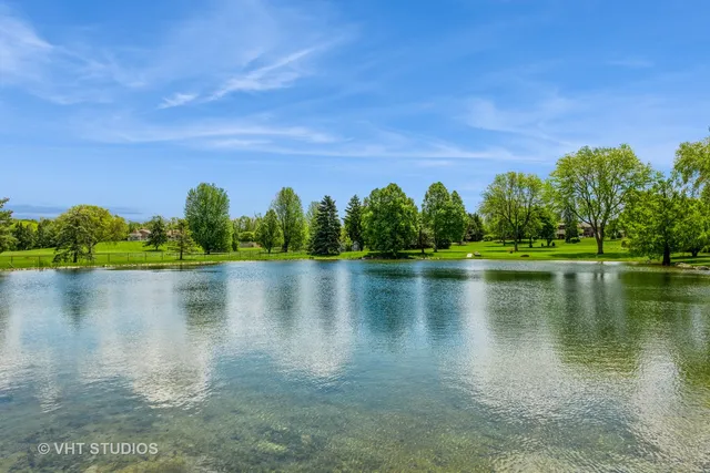 a view of a lake with a house in the background