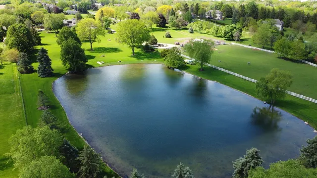 an aerial view of a houses with yard