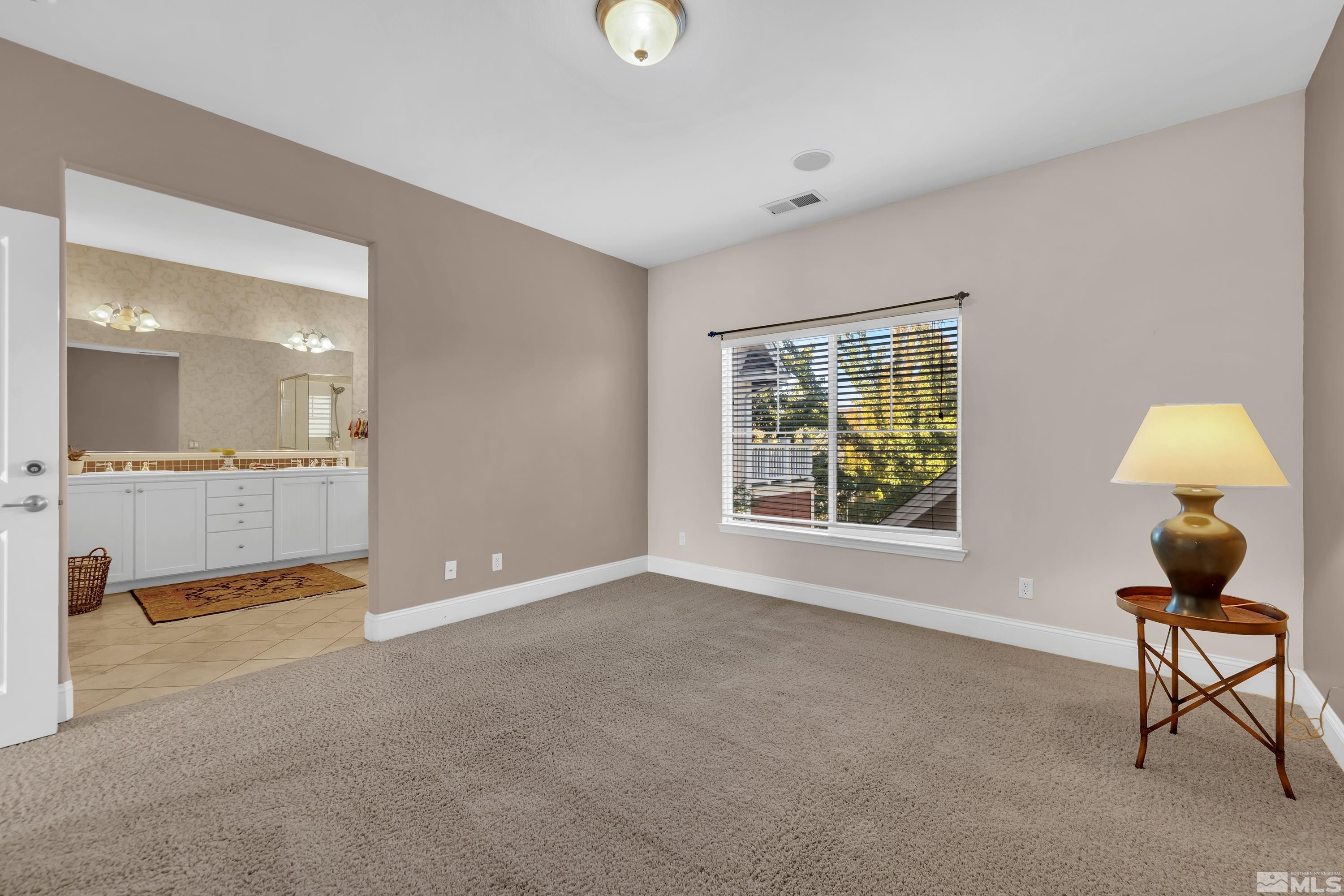 1410 Waterloo Drive Reno, NV 89509 - Photo 24 of 37 a view of an empty room with window and bathroom