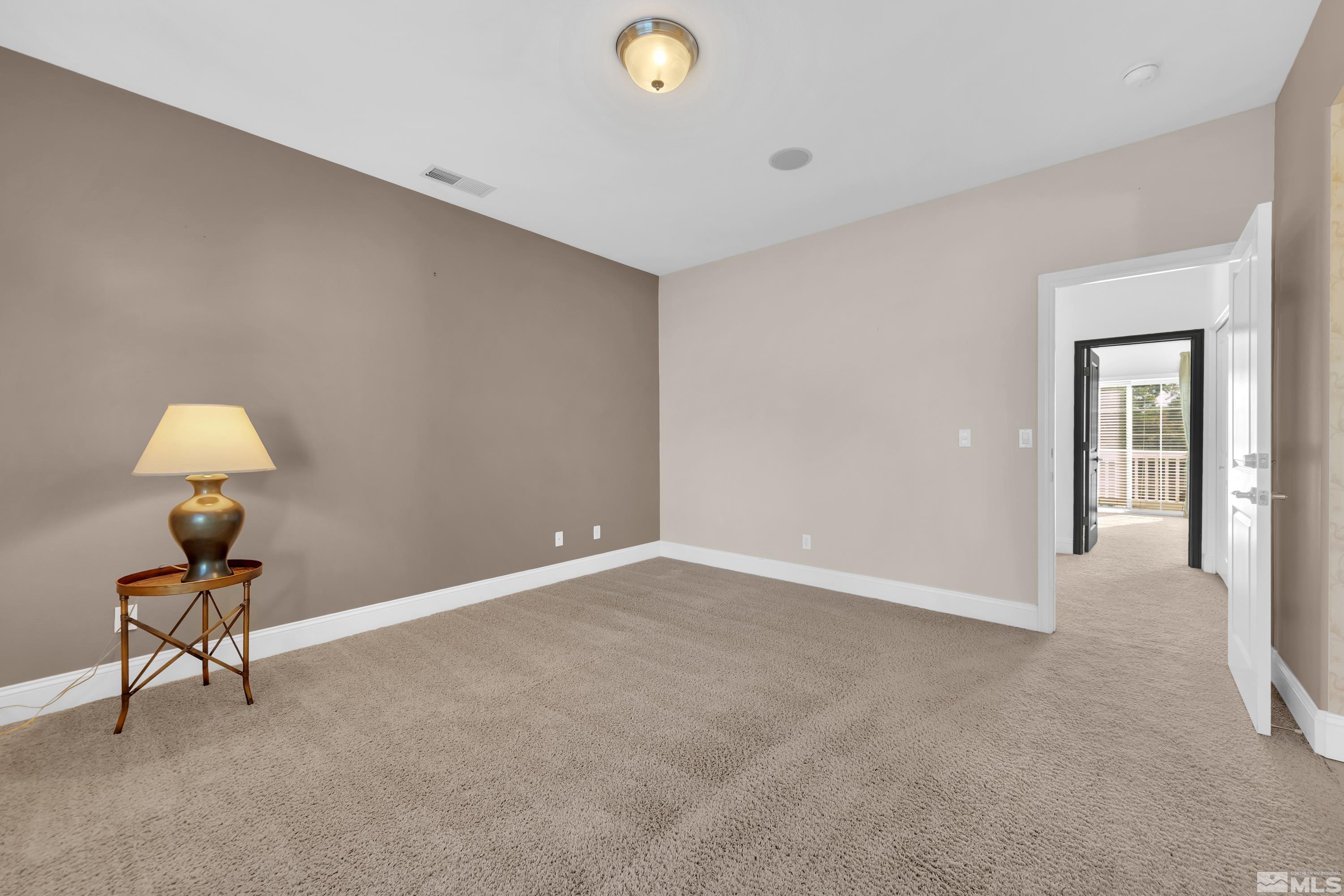 1410 Waterloo Drive Reno, NV 89509 - Photo 25 of 37 a view of an empty room and chandelier fan