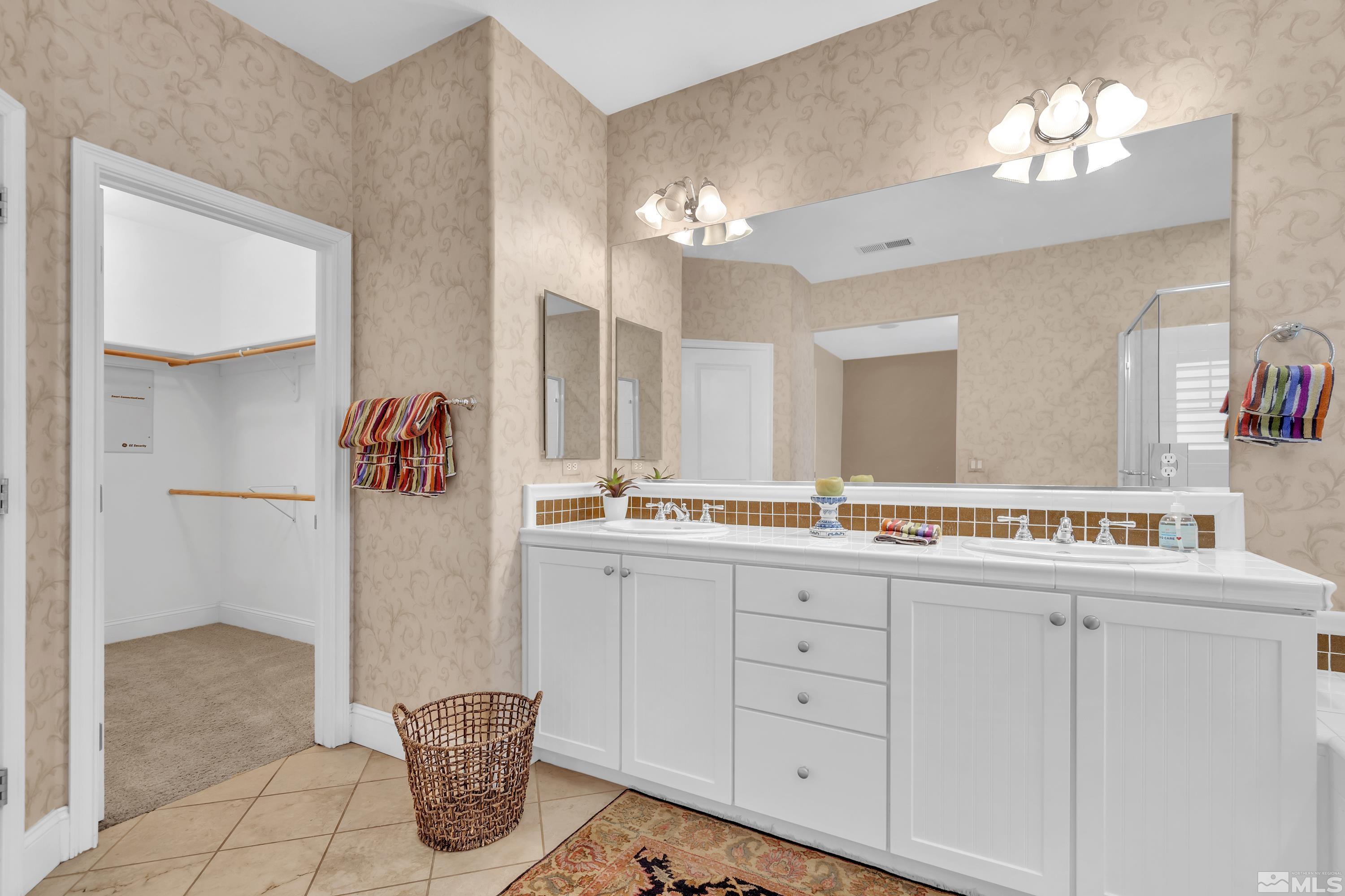 1410 Waterloo Drive Reno, NV 89509 - Photo 27 of 37 a kitchen with a sink and chandelier