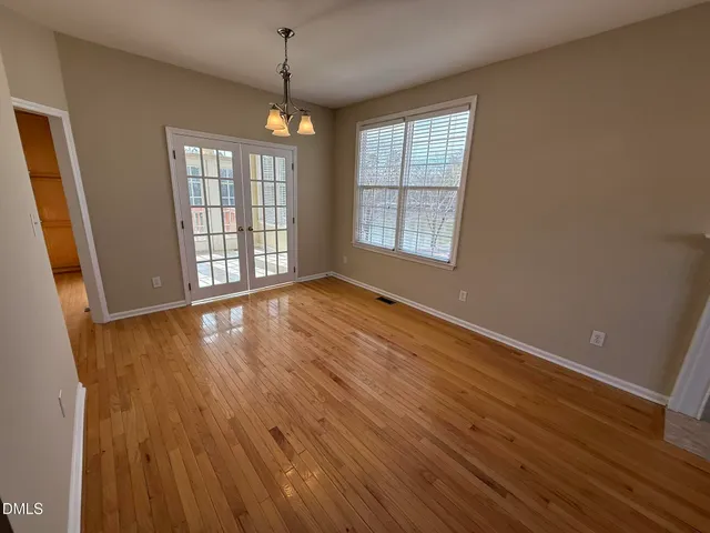 a view of a house with a wooden deck