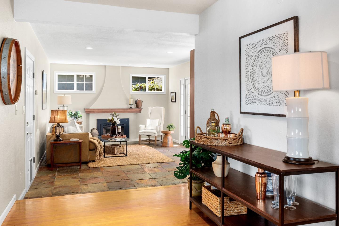 105 Wesley Street Capitola, CA 95010 - Photo 18 of 55 a living room with furniture a table and paintings on the wall