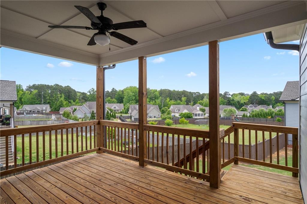 712 Fleeting Way Monroe, GA 30655 - Photo 26 of 29 a view of a balcony with wooden floor