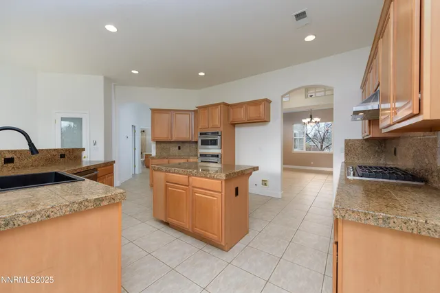 a kitchen with cabinets and window