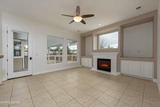 a view of a hallway with closet and bathroom