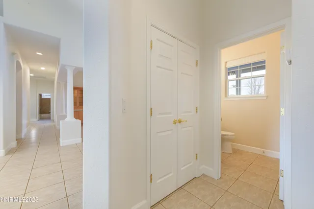 a bathroom with a toilet a sink and a mirror