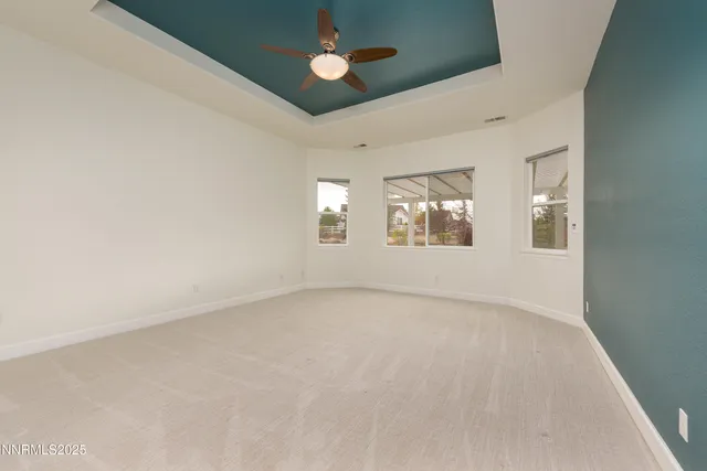 a large spacious bathroom with a tub sink shower and mirror