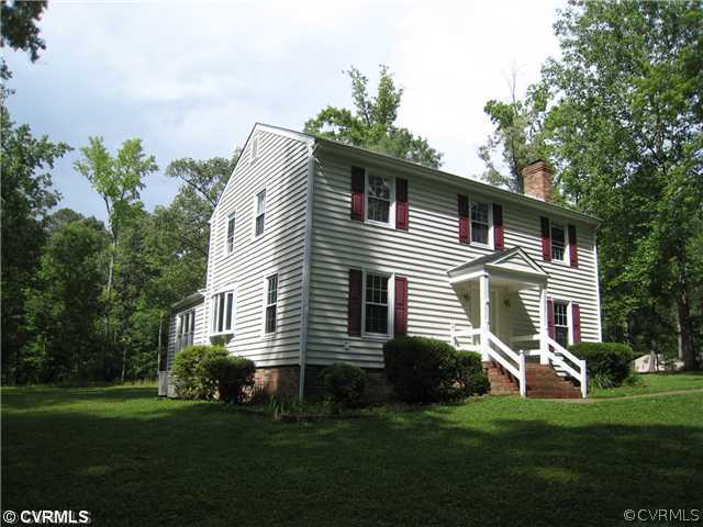 13010 Singer Road Midlothian, VA 23112 - Photo 5 of 10 a front view of a house with a garden