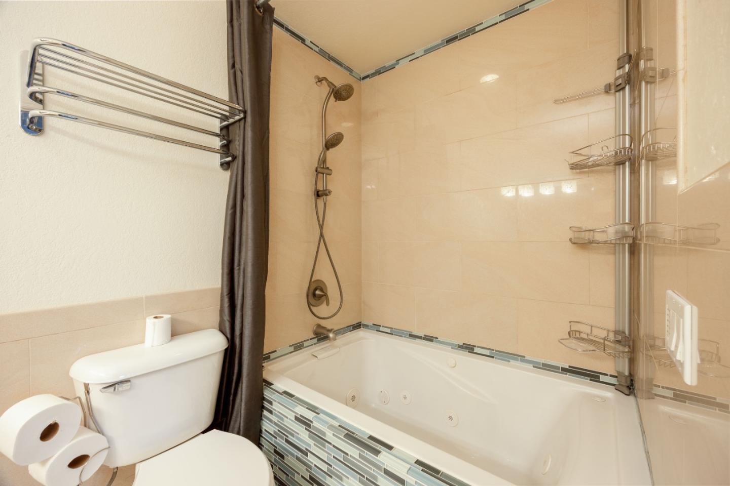 9 Merion Road Half Moon Bay, CA 94019 - Photo 12 of 14 a bathroom with a granite countertop bathtub and a shower