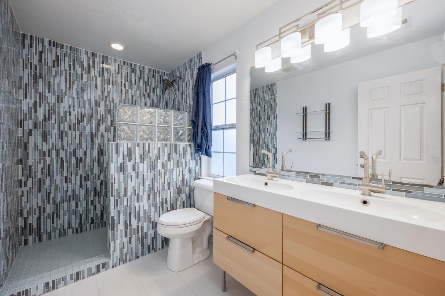 9 Merion Road Half Moon Bay, CA 94019 - Photo 13 of 14 a bathroom with a sink a toilet and shower