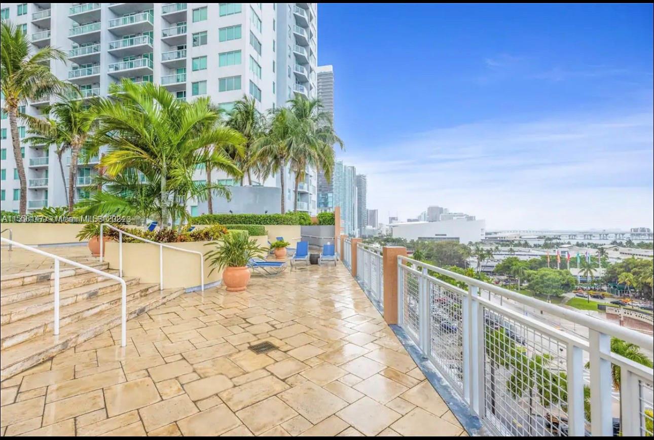 Downtown Miami Miami, FL 33132 - Photo 17 of 18 a view of a swimming pool with a patio