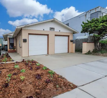 a front view of a house with a garage