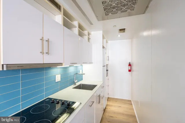 a kitchen with a stove and a refrigerator