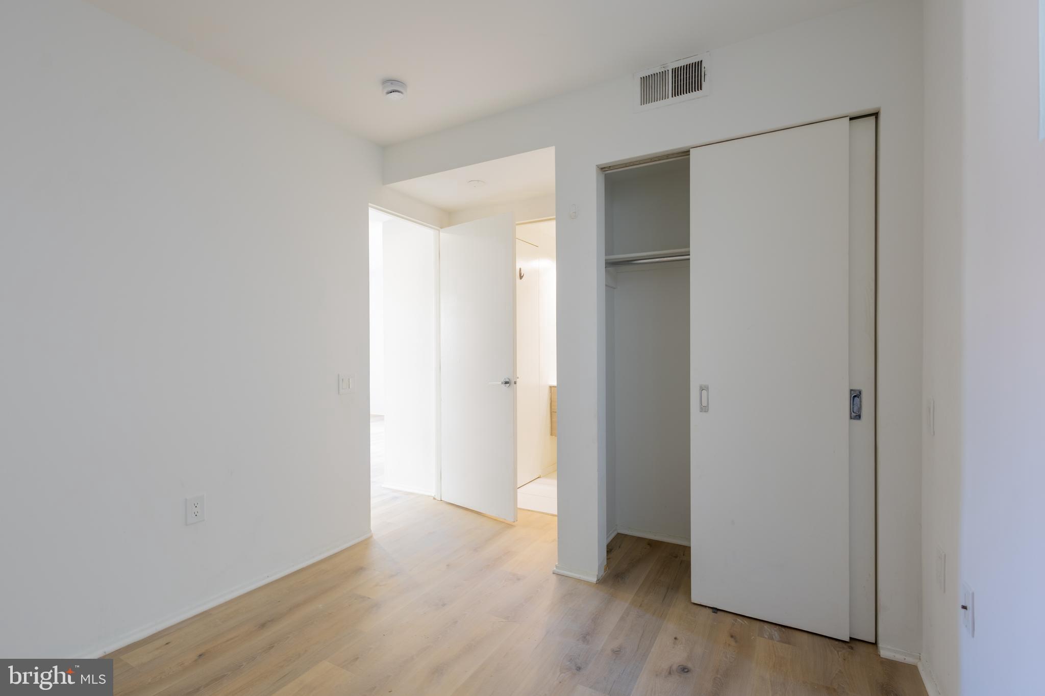 2422-2424 17th Street Northwest, Unit 201 Washington, DC 20009 - Photo 2 of 16 a view of an empty room with wooden floor