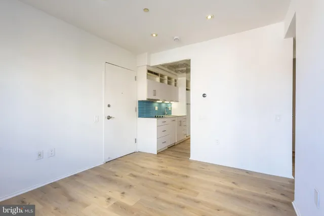a view of a kitchen cabinets and wooden floor