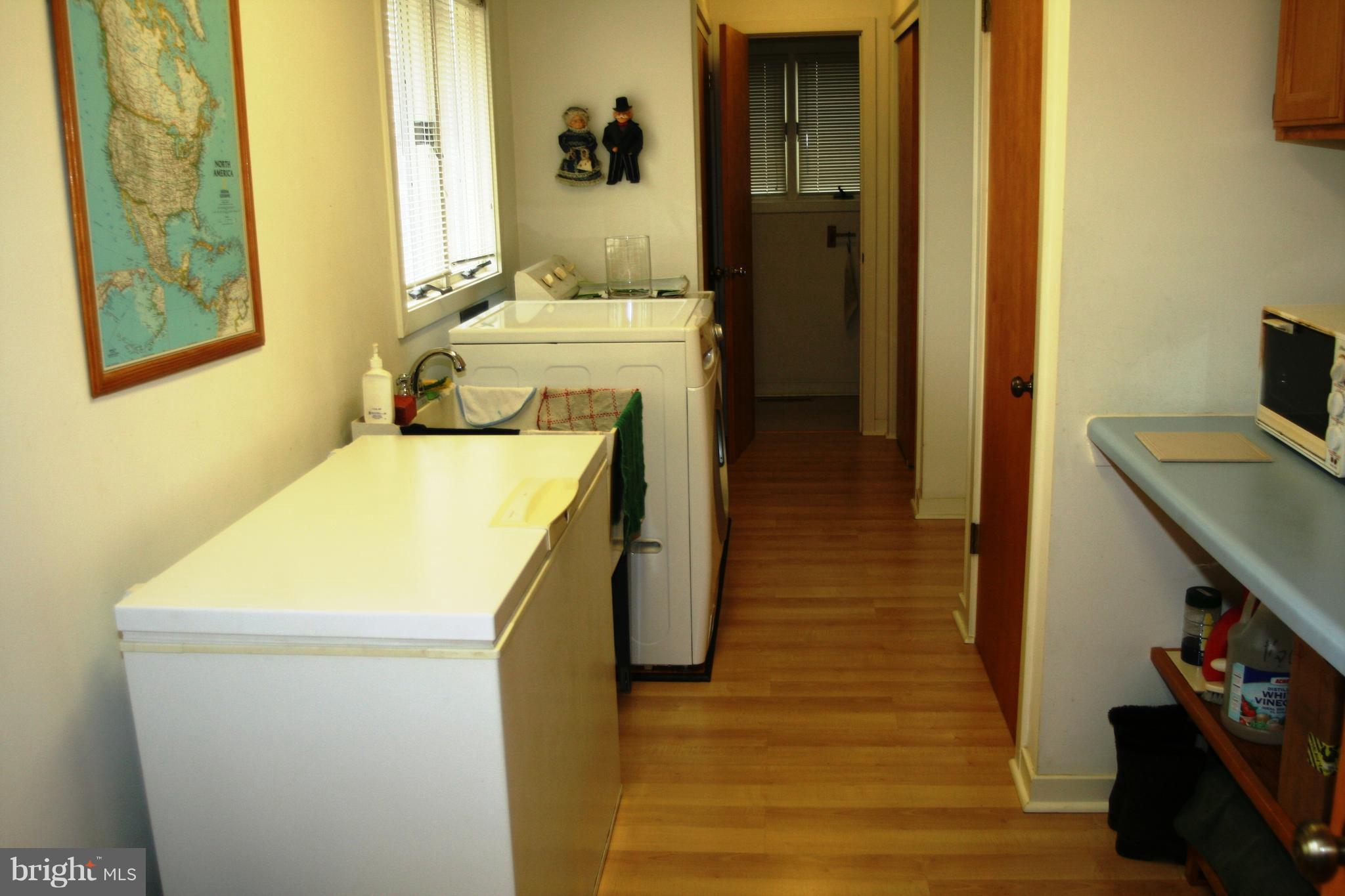 8560 Camp Road Chestertown, MD 21620 - Photo 10 of 17 Large laundry room with chest freezer.