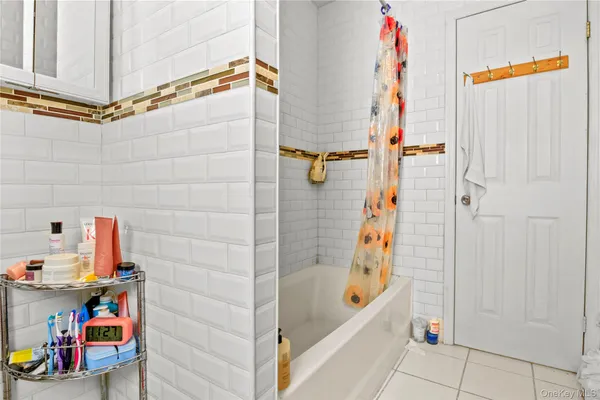 a bathroom with a bathtub and shower