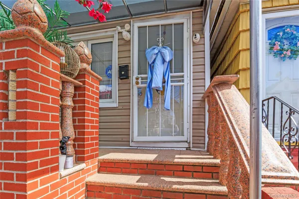 a view of front door of house and stairs