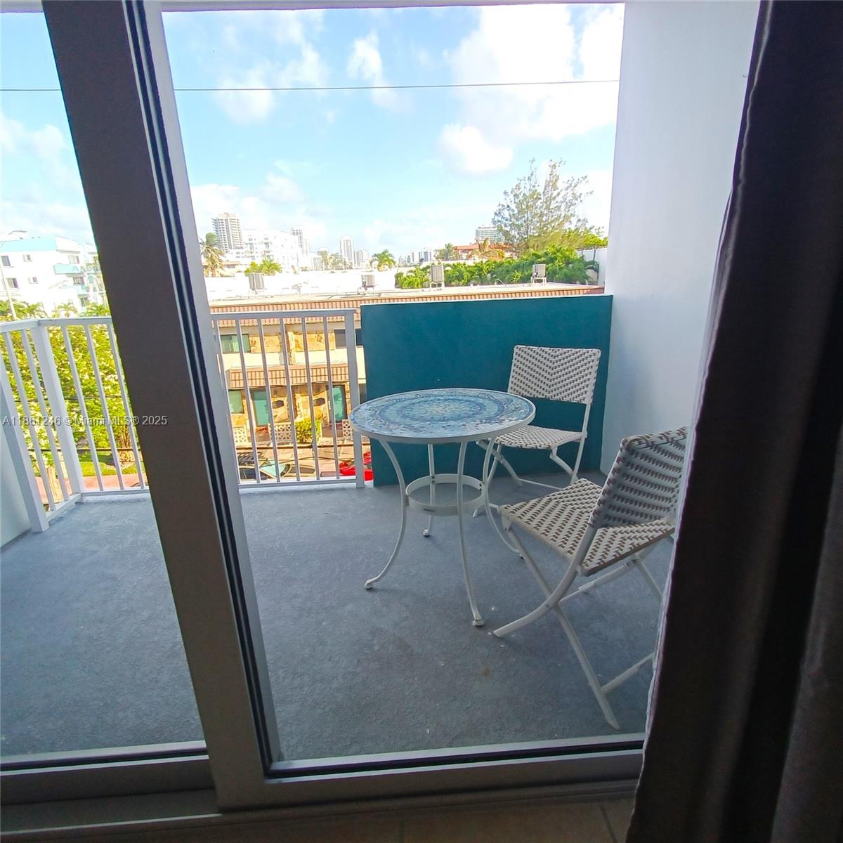 8000 Harding Avenue, Unit 3B Miami Beach, FL 33141 - Photo 20 of 30 a view of a living room with a floor to ceiling window