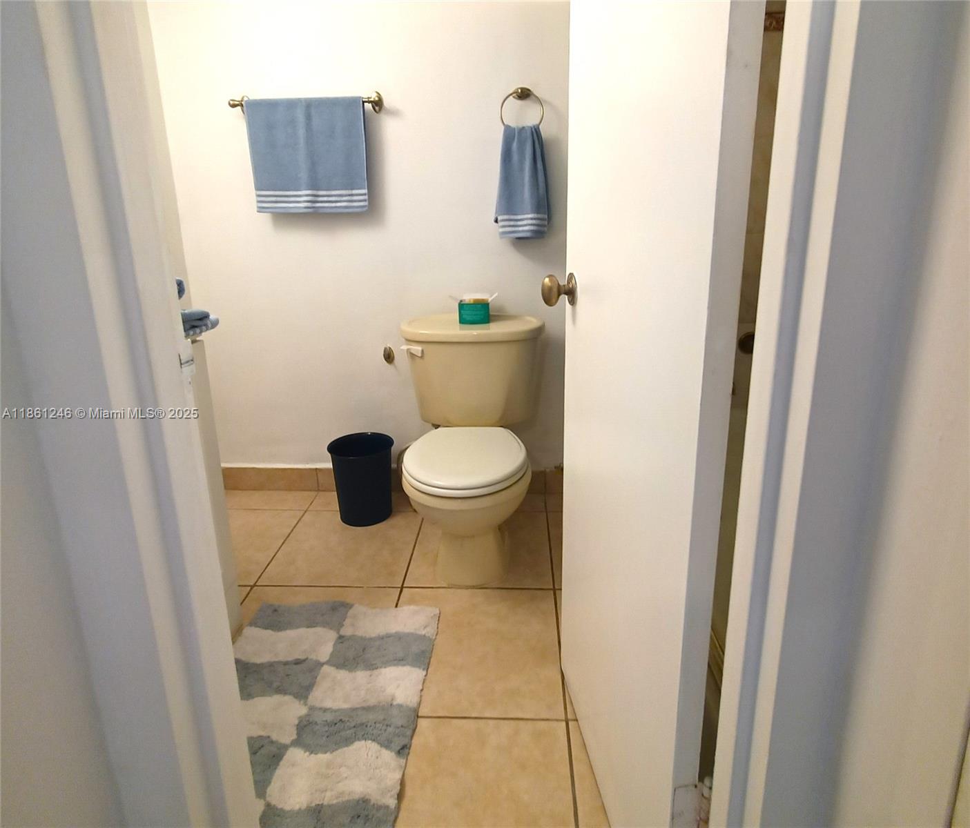 8000 Harding Avenue, Unit 3B Miami Beach, FL 33141 - Photo 23 of 30 a bathroom with a toilet and a sink