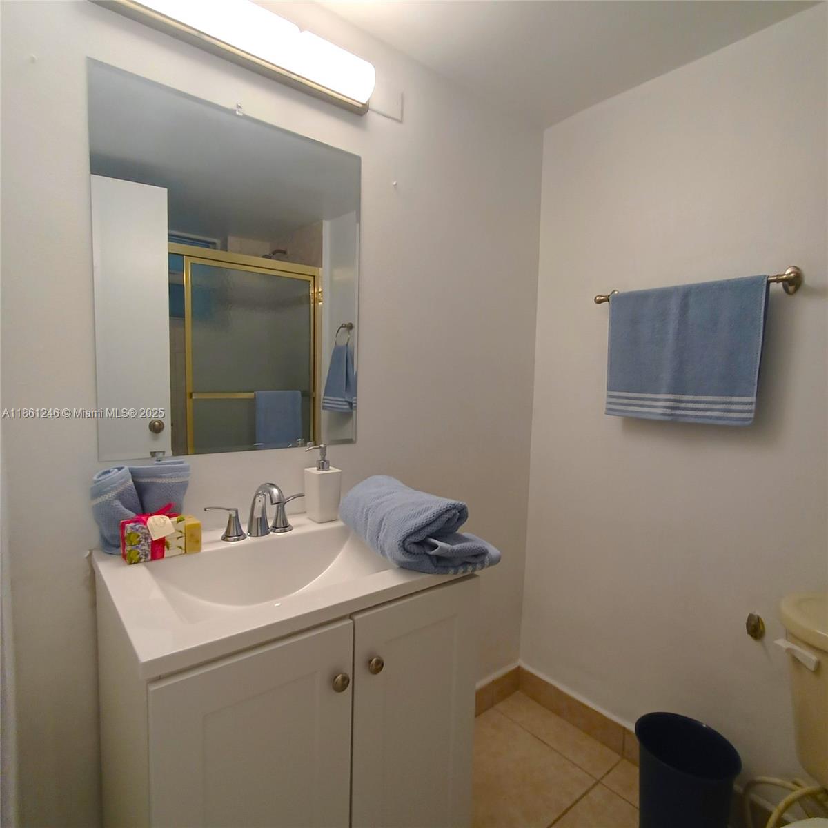 8000 Harding Avenue, Unit 3B Miami Beach, FL 33141 - Photo 24 of 30 a bathroom with a sink and a vanity
