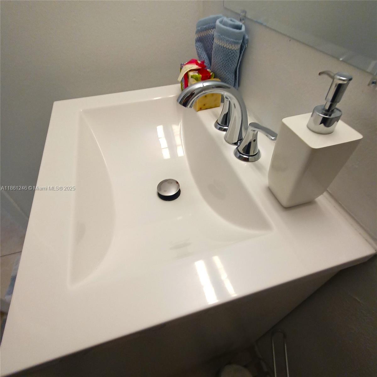8000 Harding Avenue, Unit 3B Miami Beach, FL 33141 - Photo 27 of 30 a bathroom with a sink