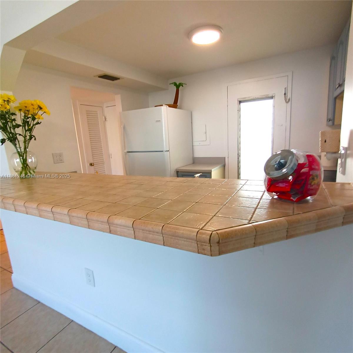 8000 Harding Avenue, Unit 3B Miami Beach, FL 33141 - Photo 30 of 30 a bedroom with a bed and a dresser