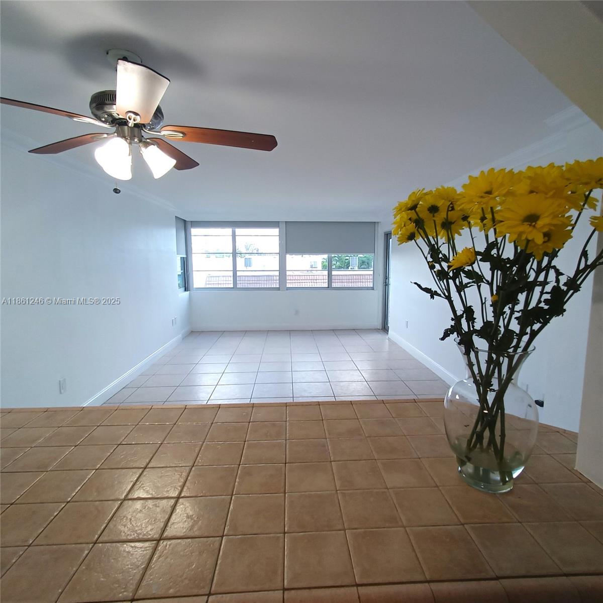 8000 Harding Avenue, Unit 3B Miami Beach, FL 33141 - Photo 5 of 30 a view of a livingroom with furniture and chandelier fan
