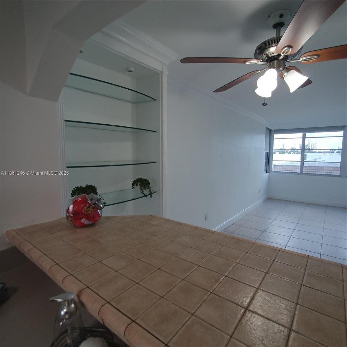 8000 Harding Avenue, Unit 3B Miami Beach, FL 33141 - Photo 6 of 30 a view of a livingroom with an empty space & a window