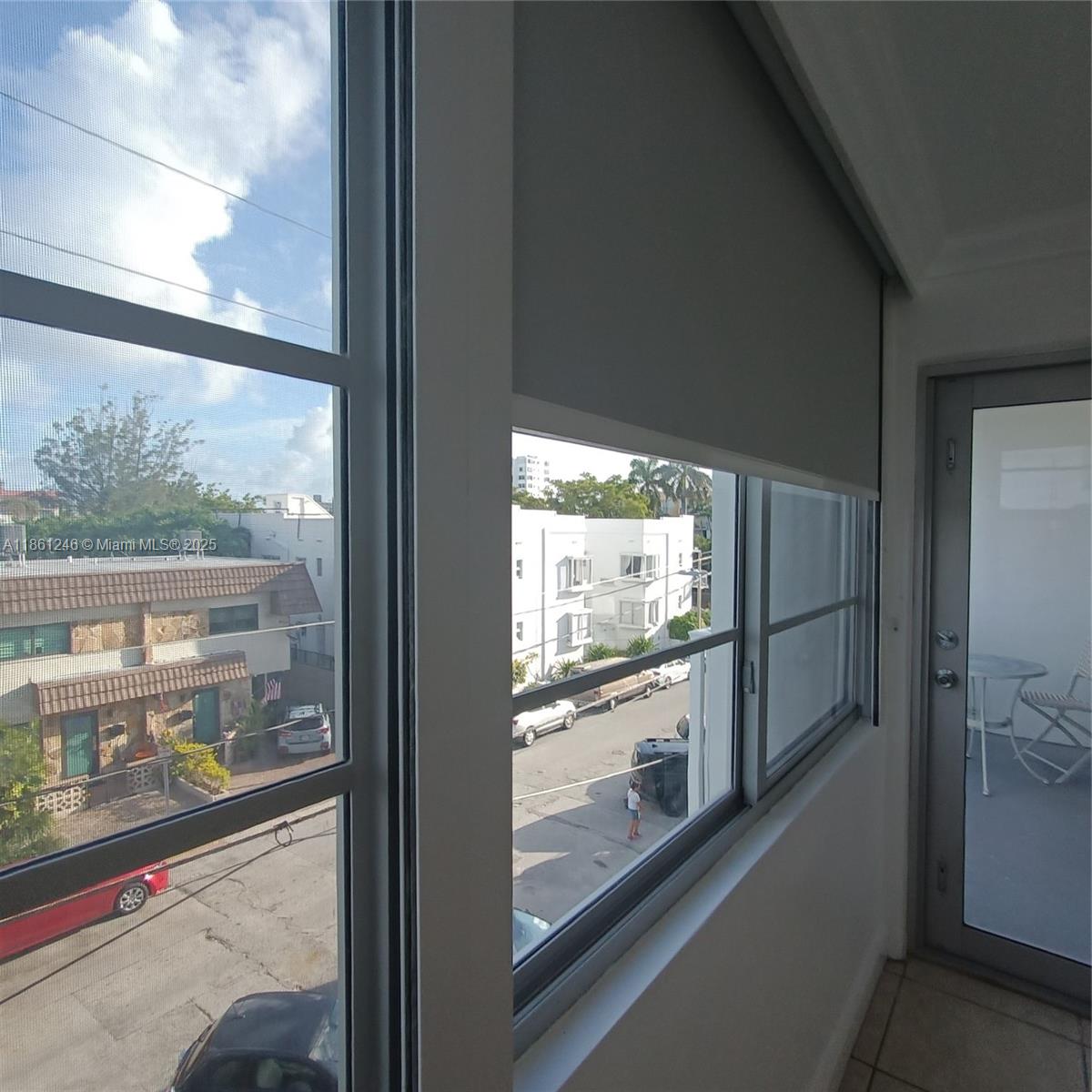 8000 Harding Avenue, Unit 3B Miami Beach, FL 33141 - Photo 8 of 30 a view of a glass door and a car parked from a window