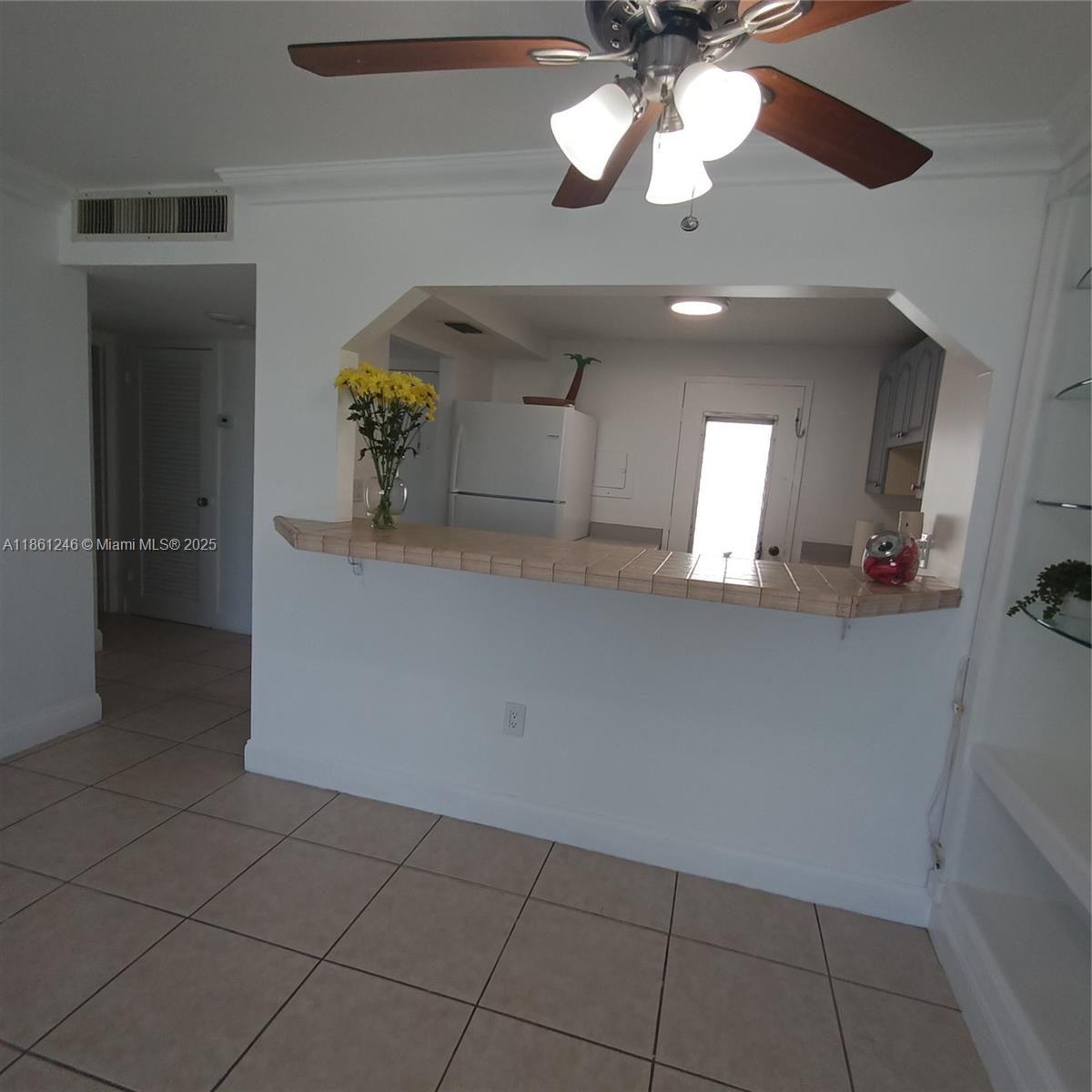 8000 Harding Avenue, Unit 3B Miami Beach, FL 33141 - Photo 9 of 30 a view of a hallway with a chandelier
