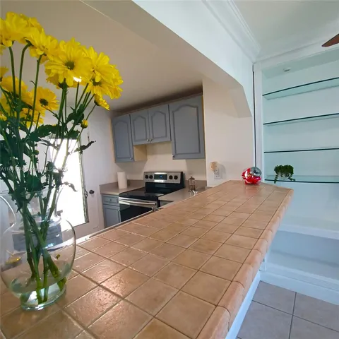 a bedroom with a bed and a potted plant